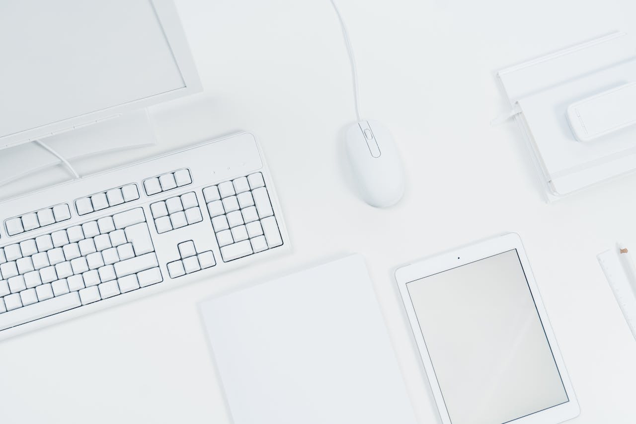 White Tablet and Computer Set of a Desk