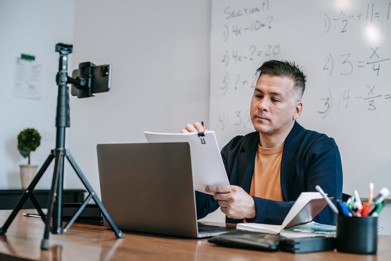 Photo Of Man Fixing Paperworks