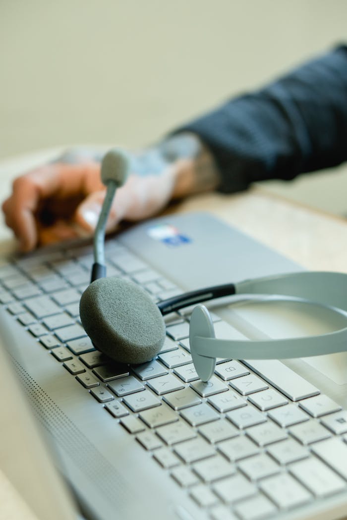 Close-Up View of a Laptop and a Headset